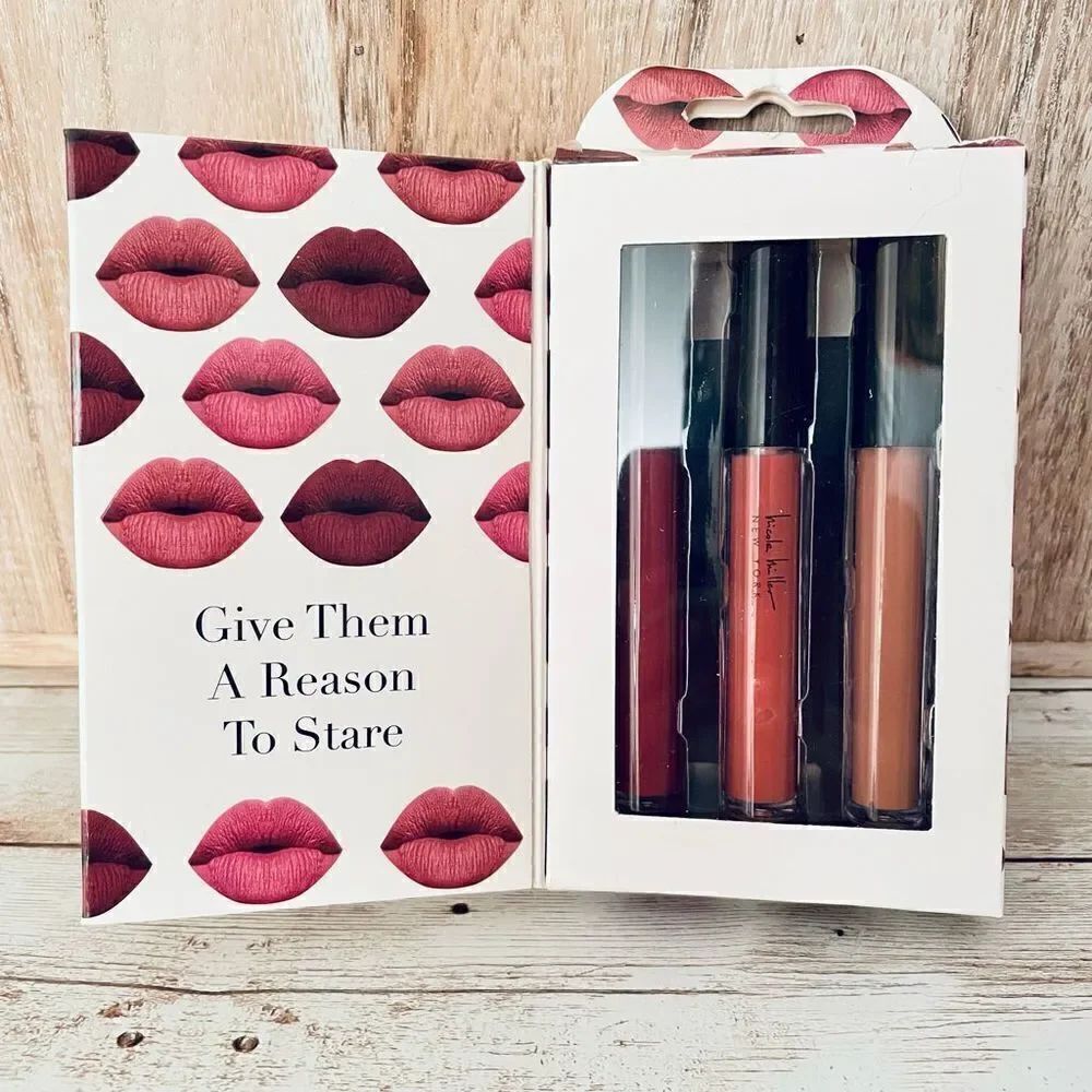New in Box Nicole Miller Lip Gloss Trio with 3 different beautiful colors